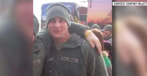 A group of veterans and community advocates holding a banner promoting mental health awareness for service members in the legal system